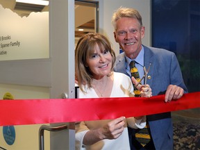 Founders Dr. Shelley Spaner and the Calgary Herald's Bill Brooks get ready for the ribbon cutting at the new Men's Health Clinic at the Rockyview Hospital in Calgary on Wednesday June 6, 2018.