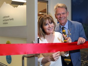 Founders Dr. Shelley Spaner and the Calgary Herald's Bill Brooks get ready for the ribbon cutting at the new Men's Health Clinic at the Rockyview Hospital in Calgary on Wednesday June 6, 2018. Darren Makowichuk/Postmedia