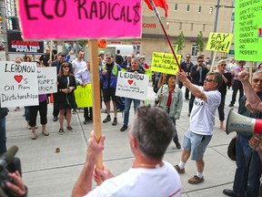 Both pro and anti Trans Mountain pipeline protesters were on hand as anti pipeline protester delivered a petition to Liberal MP Kent Hehr's office in downtown Calgary on Monday June 4, 2018. The petition was demanding a stop to the government's plan to buy Trans Mountain.