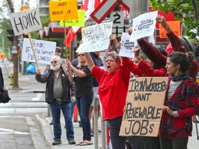 Protesters on both sides of the Trans Mountain pipeline issue  were on hand outside  Liberal MP Kent Hehr's office in downtown Calgary on Monday June 4, 2018.