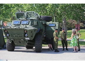Soldiers with the King's Own Calgary Regiment show off one of the military's new $2.5 Million TAPV (Tactical Armoured Patrol Vehicle) vehicles at Spruce Meadows on Thursday June 7, 2018. Gavin Young/Postmedia
