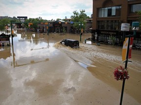 Fourth street at 24th avenue in Calgary's Mission neighbourhood on June 22, 2013 with flood waters from the Elbow River filling the streets.  Stuart Gradon/Calgary Herald     ORG XMIT: POS2013062320293371