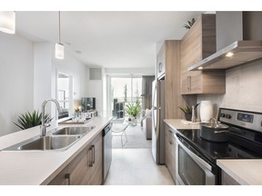 The kitchen in the Calligraphy show suite with one bathroom and a den at Westman Village.