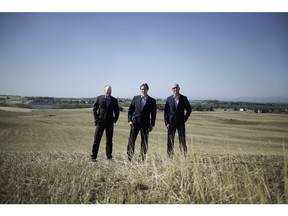 Standing on the future land for the Cochrane North development, from left to right, from Canopy Lands, William Schickedanz, Graham Green, and Asad Niazi.