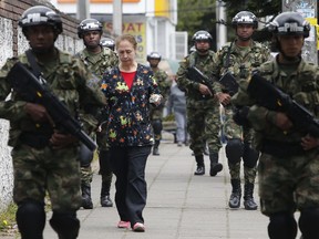 Soldiers patrol as part of pre-electoral security in Bogota, Colombia, Saturday, June 16, 2018.