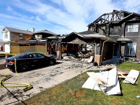 Three houses in 7200 blk of Laguna Way NE were gutted by fire on Saturday night and are shown on Sunday, June 3, 2018. All residents managed to get out of the houses and CFD Investigators are on scene Sunday. Jim Wells/Postmedia