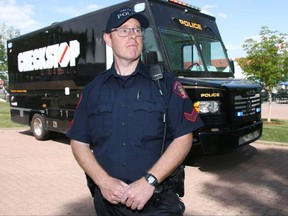 Calgary Police Service Cst Dan Kurz poses outside the Checkstop bus on display at Spruce Meadows in Calgary on Friday, June 8, 2018. Jim Wells/Postmedia