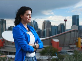 Emma May poses with the Calgary skyline in the background on Friday, June 29, 2018. Jim Wells/Postmedia