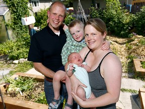 Timothy Haney, Director of the Centre for Community Disaster Research at Mount Royal University and his wife Sara with their children L-R, Evan,5, and Adam,6weeks, as his son Evan was born on the day of the great flood and his wedding was interrupted by a tornado. Disaster seems to be as passionate about Haney as he is about researching their effect of people victimized by natural disasters. Tuesday June 19, 2018. Darren Makowichuk/Postmedia