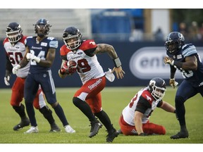Calgary Stampeders quarterback Bo Levi Mitchell (19) rushes up field during the first half of CFL football game action against the Calgary Stampeders at BMO Field in Toronto, Ontario on Saturday June 23, 2018.