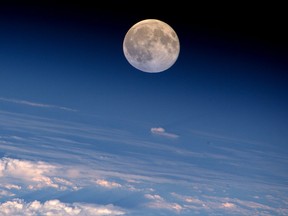 A view of a full moon seen from the International Space Station.