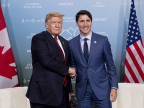 Canada's Prime Minister Justin Trudeau meets with U.S. President Donald Trump at the G7 leaders summit in La Malbaie, Que., on Friday, June 8, 2018.