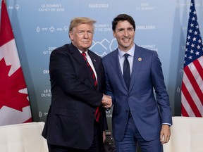 Canada's Prime Minister Justin Trudeau meets with U.S. President Donald Trump at the G7 leaders summit in La Malbaie, Que., on Friday, June 8, 2018.