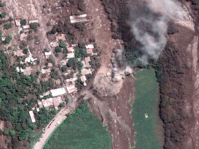 This June 6, 2018 satellite image provided by Digital Globe shows the hamlet of San Miguel Los Lotes, Guatemala, after the hamlet was encased in volcanic ash following the June 3 eruption of the Volcan de Fuego, which means in English "Volcano of Fire."