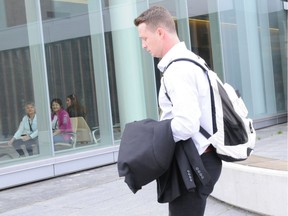 Hockey player Guillaume Donovan leaves the Thunder Bay, Ont., courthouse after being found not guilty of sexual assault.