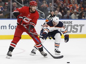 The Calgary Flames acquired Noah Hanifin, left, and Elias Lindholm in a trade with the Carolina Hurricanes on Saturday.