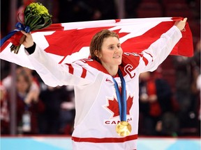 Canada's Hayley Wickenheiser celebrates after defeating the USA during the women's final ice hockey game at the Vancouver 2010 Olympics in Vancouver, Thursday Feb. 25, 2010.