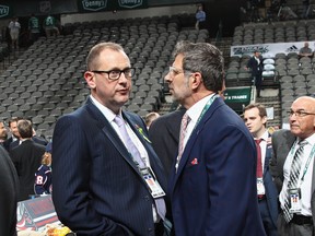 DALLAS, TX - JUNE 22: Brad Treliving of the Calgary Flames and Marc Bergevin of the Montreal Candiens chat prior to the first round of the 2018 NHL Draft at American Airlines Center on June 22, 2018 in Dallas, Texas. (Photo by Bruce Bennett/Getty Images)