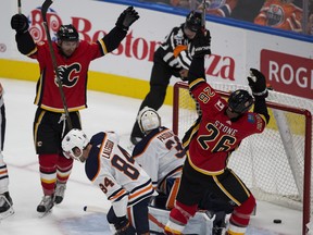 Calgary Flames Emile Poirier and Michael Spoon celebrate a goal on Edmonton Oilers goalie Edward Pasquale that was scored after the second period buzzer on Monday September 18, 2017 in Edmonton. Greg Southam / Postmedia