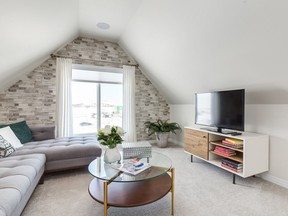 The sitting area in the optional loft of the Huntley by Excel Homes.