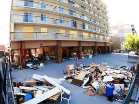 Debris is shown behind the Kensington Manor apartment building in the 300 block of 10 St N.W. in Calgary on Tuesday, June 26, 2018.