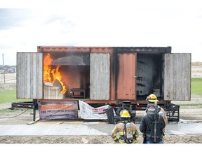 This shows the side of the trailer that has an active residential sprinkler, containing the blaze to the couch.