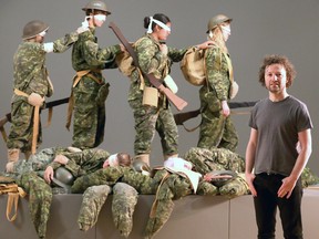 Artist Adad Hannah with volunteers recreates the powerful large oil painting Gassed by American artist John Singer Sargent in 1919, dozens of men lay dead or dying on the First World War battlefield as blinded and injured soldiers are led to a casualty tent to be treated for mustard gas at the Military Museums of Calgary on Wednesday June 20, 2018. Darren Makowichuk/Postmedia