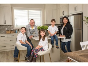 Kendall Ready-Father Leslie Ready-Mother Kaleb-8yrs Sierra-6yrs Benjamin-3yrs in the Morrison Show home in D'Arcy, Okotoks. Photo by Don Molyneaux/The Herald.