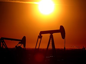 Two pumpjacks are seen  at sunset near Fort Saskatchewan, Alta., on Oct. 27, 2015.