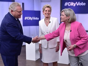 The Ontario election has come down to a choice between Progressive Conservative Leader Doug Ford and NDP Leader Andrea Horwath, right. Liberal Premier Kathleen Wynne, centre, looks on prior to the leaders debate in Toronto on May 7, 2018.