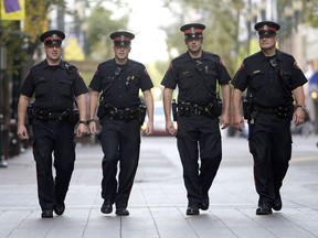 Calgary police patrol Stephen Avenue in downtown Calgary.