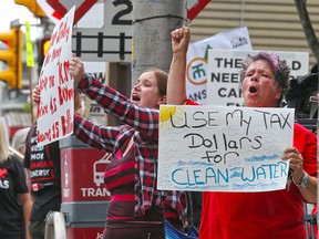 Protesters for and against  the Trans Mountain pipeline gather outside Liberal MP Kent Hehr's office in downtown Calgary on Monday June 4, 2018.