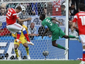 Russia's Artyom Dzyuba scores his side's third goal during the group A match between Russia and Saudi Arabia at the 2018 soccer World Cup in Moscow, Thursday, June 14, 2018.