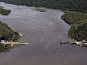 Crews work to clean up an oil spill on the North Saskatchewan river near Maidstone, Sask. on July 22, 2016.