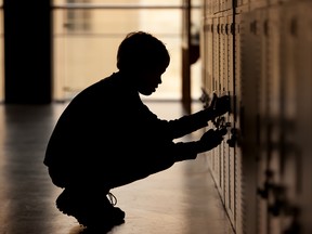 File photo of a student opening a locker.