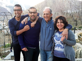 This undated photo shows the late Iranian-Canadian professor Kavous Seyed-Emami and his wife, Maryam Mombeini, right, and their two sons in unidentified place in Iran.