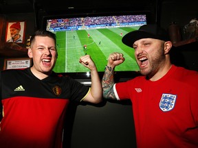 Nicolas Jekill (left) and Joshua White are pumped as they watch the kick off to the World Cup at The Ship and Anchor Pub on 17th Avenue S.W. in Calgary on June 14, 2018.