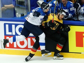 Finland's Eeli Tolvanen checks Germany's Yasin Ehliz during a world championship match between Germany and Finland at the Jyske Bank Boxen arena in Herning, Denmark on May 13, 2018