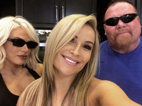 WWE Superstar Lana, left, Natalya Neidhart and Jim 'The Anvil' Neidhart pose for a selfie.