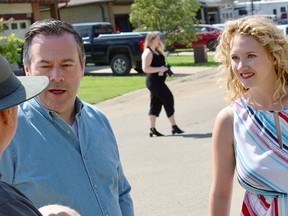 UCP Leader Jason Kenney and Fort McMurray-Conklin candidate Laila Goodridge speak with a supporter while campaigning in the Grayling Terrace neighbourhood of Fort McMurray, Alta. on Saturday, June 16, 2018.