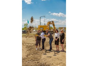 From left Neil Mitchell, sales manager, Attainable Homes Calgary Corp.;
Victor Mutambo, vice president, Avi Urban;
Charron Ungar, president, Avi Urban, Kelly Schmalz, development manager at Genstar Development and
Catherine Wolski, area sales manager, Avi Urban, turn shovels for the start of construction at Winston at Walden.