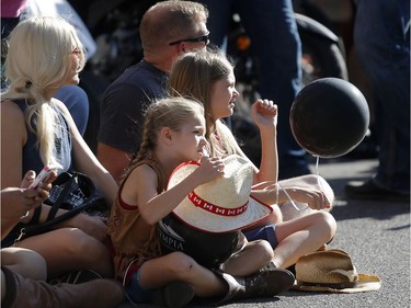 Spectators enjoy the 2018 Calgary Stampede Parade on Friday July 6, 2018. Leah Hennel/Postmedia