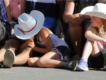 Tired parade goers during the 2018 Calgary Stampede Parade in Calgary, on Friday July 6, 2018. Leah Hennel/Postmedia