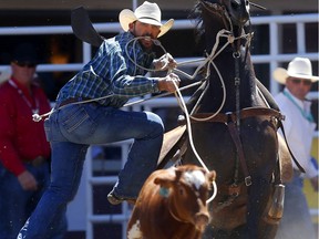 Cade Swor of Winnie, Texas during the Calgary Stampede tie-down championships at the the Calgary Stampede in Calgary on Saturday July 7, 2018. Leah Hennel/Postmedia