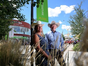 Cherie Copithorne-Barnes, Stampede western events committee and John Betts, McDonald's president and CEO pose for a photo at the Calgary Stampede on Wednesday July 11, 2018. Leah Hennel/Postmedia