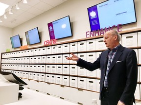 Nova Scotia Liquor Corporation president and CEO Bret Mitchell gestures during a media tour of a cannabis section at one of its stores in Halifax.