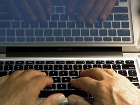 Hands at computer keyboard