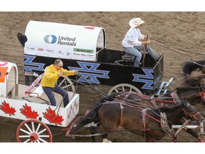 Chanse Vigen (right), driving for his dad, Mike Vigen, hit a barrel but but held off Chad Harden (left) to finish first in Saturday’s Heat 3 at the Calgary Stampede. Vigen’s time-fault, however, gave Harden the heat win and second on the day. Mike Drew/Postmedia