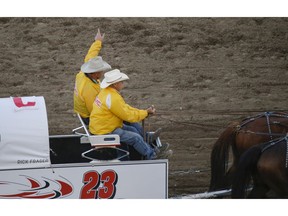 Rick Fraser waves to the crowd after he finishes the race in Heat 7 of the Rangeland Derby at the Calgary Stampede in Calgary, Ab., on Saturday July 14, 2018. Mike Drew/Postmedia