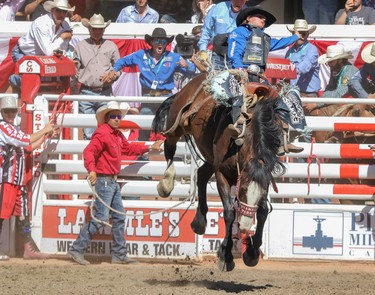 Ryder Wright, Milford, Utah, wins the Saddle Bronc final in the Stampede Rodeo at the Calgary Stampede in Calgary, Ab., on Sunday July 15, 2018. Mike Drew/Postmedia